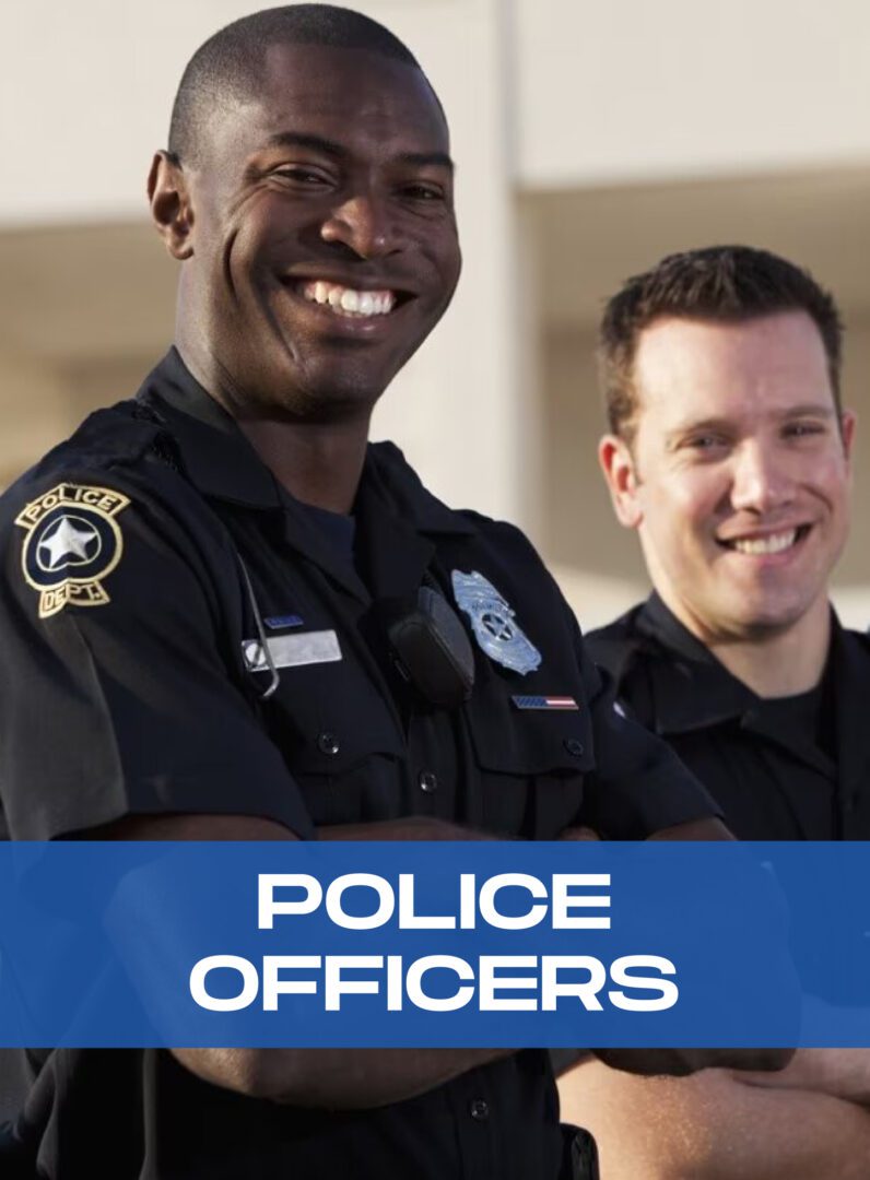 Two police officers smiling for a picture.